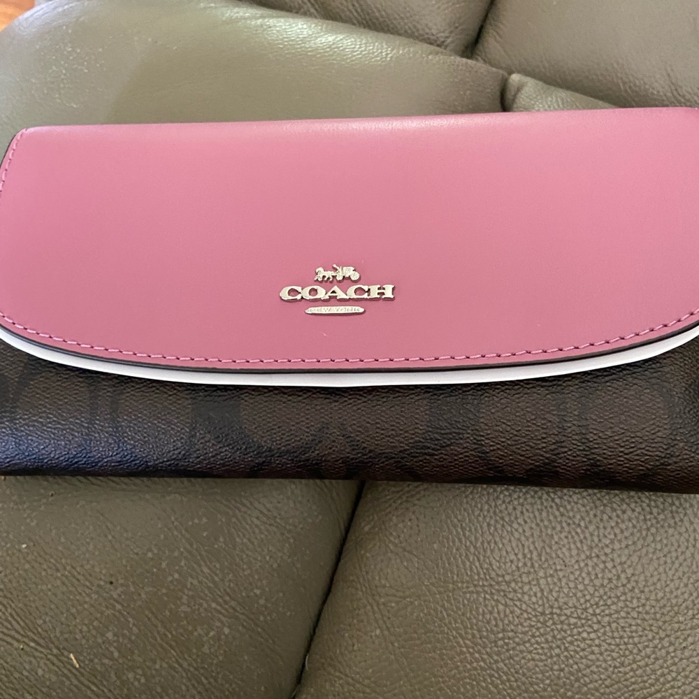 Beautiful leather brown and pink coach wallets never used